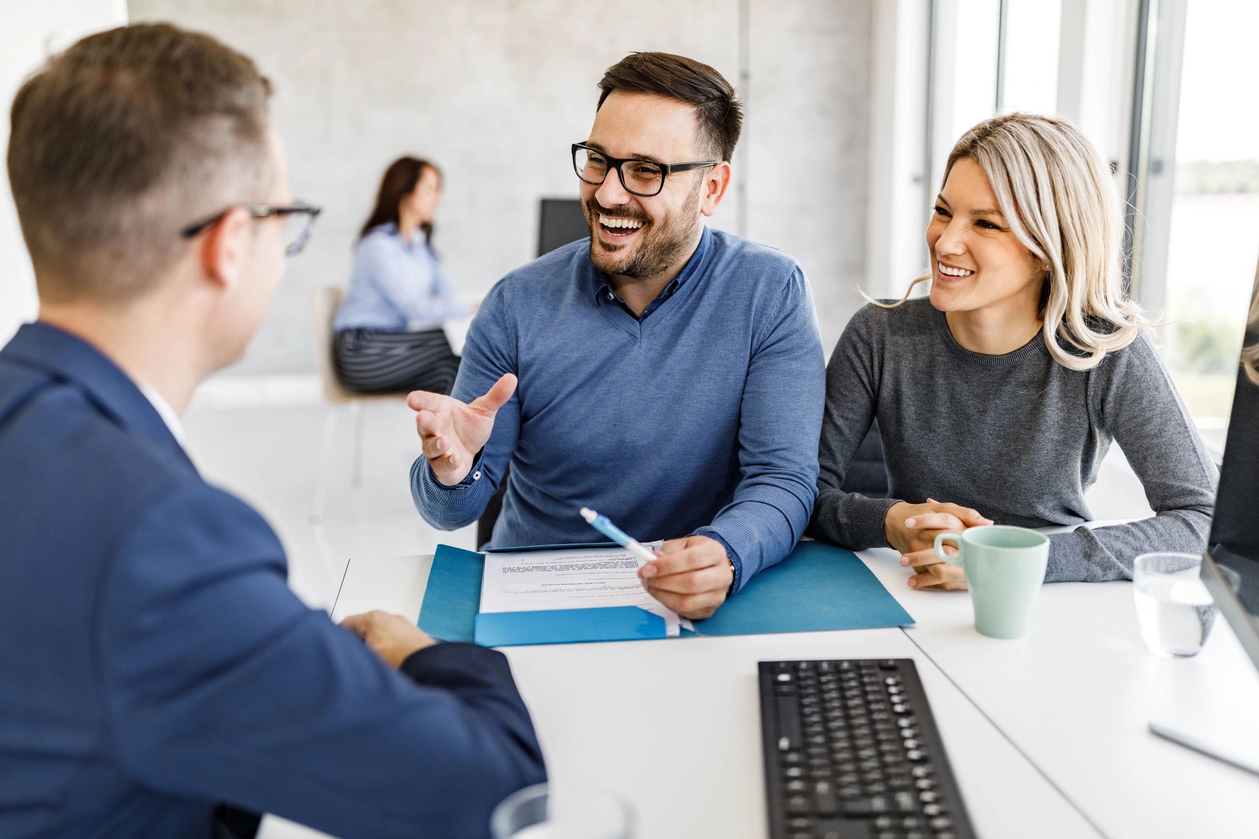 Professional meeting representing real estate acquisition discussions